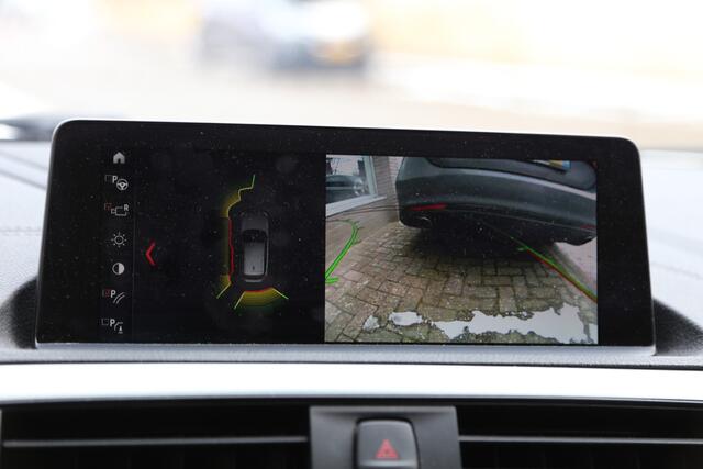 BMW 1-SERIE 118i M-Sport High Exec Autom Schuifdak HK Camera Leer Navi LED