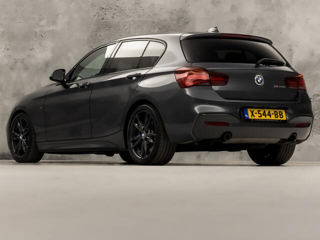 BMW 1-SERIE M140i M Sport High Executive 340Pk Automaat (6 CILINDER, M PAKKET, HARMAN/KARDON, ALCANTARA, CAMERA, SPORTSTOELEN, M SPORTREMMEN, NAVIGATIE, STOELVERWARMING, GETINT GLAS, NIEUWSTAAT)