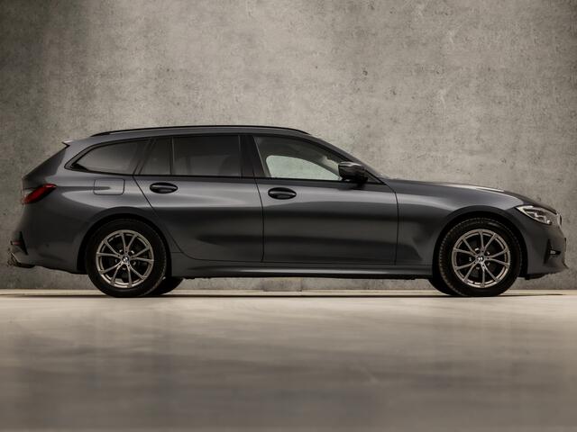 BMW 3-SERIE Touring 320i Sportline Shadow 184Pk Automaat (APPLE CARPLAY, GROOT NAVI, CAMERA, LEDER, ADAPTIVE CRUISE, SFEERVERLICHTING, SPORTSTOELEN, HIFI, TREKHAAK ELEKTRISCH, GETINT GLAS, NIEUWSTAAT)