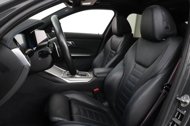 BMW 3-SERIE 320e M Sport | Schuifdak | Laserlight | Leder | Stoelverwarming | Carplay | Sfeerverlichting | Camera | Live Cockpit | Sportstoelen | Navigatie | Park Assist | Dodehoek detectie