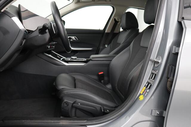 BMW 3-SERIE 320e Business | Stoelverwarming | Adaptive cruise | Trekhaak | Harman/Kardon | Carplay | Camera | Half leder | Sportstoelen