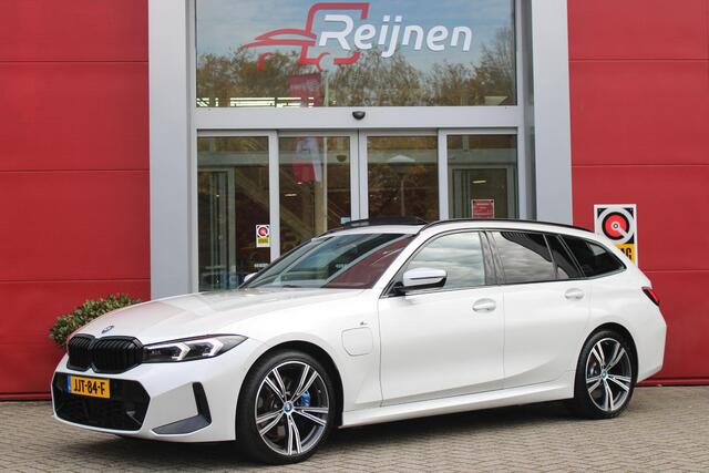 BMW 3-SERIE Touring 330e 292PK M-SPORT | M-SPORT PRO-PAKKET | M-SPORT REMMEN UITGEVOERD IN DONKERBLAUW MET M LOGO | BMW LIVE COCKPIT PROFESSIONAL | CURVED DISPLAY |DRIVING ASSISTANT INCL. HEAD-UP DISPLAY | PANORAMISCH SCHUIF/KANTEL DAK | PARKING ASSIST INCL. ACHTERUI