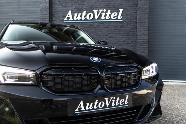 BMW 3-SERIE Touring 330e | Head-Up | Trekhaak | Sportleder | Camera | Comfort Access | Memory