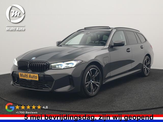 BMW 3-SERIE Touring 330e M Sport PHEV 293pk Dealer O.H. | Dravitgrau | Trekhaak Af Fabriek | Panodak | Head Up | Camera | Lederen Sportstoelen Verwarmd | Sfeerverlichting | Apple Carplay | Keyless | Blis | Cruise Control | Navigatie | DAB | Plug I