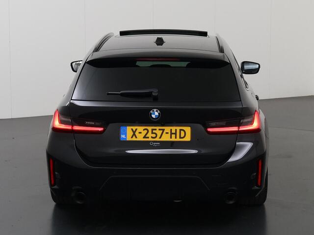 BMW 3-SERIE Touring 320i | M-Pakket | Panoramadak | Trekhaak Ele.wegklapbaar | Apple CarPlay/Android Auto | Curved Display | Stuur/Stoelverwarming | Interieur Verlichting | Sportstoelen | Camera | DAB | Ele. kofferdeksel |