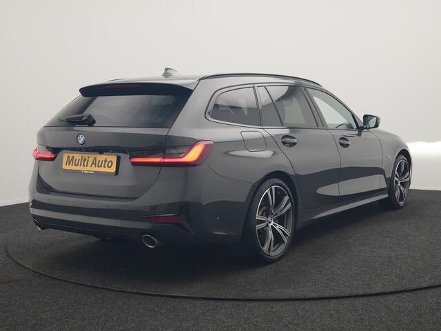 BMW 3-SERIE Touring 330e Sportline PHEV 293pk Dealer O.H. | Dravitgrau | Trekhaak Af Fabriek | Adaptive Cruise | Laser LED | Head Up | Adaptief Onderstel | Camera | Sportstoelen Verwarmd | Sfeerverlichting | Keyless | Blis | Apple Carplay | 19"L.M | Plug In Hybrid |