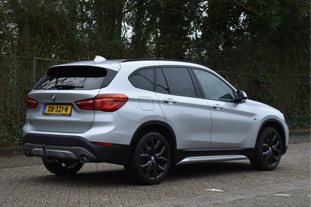 BMW X1 sDrive20i Orange Edition II Open dak | Cruise control | Navi | Trekhaak |