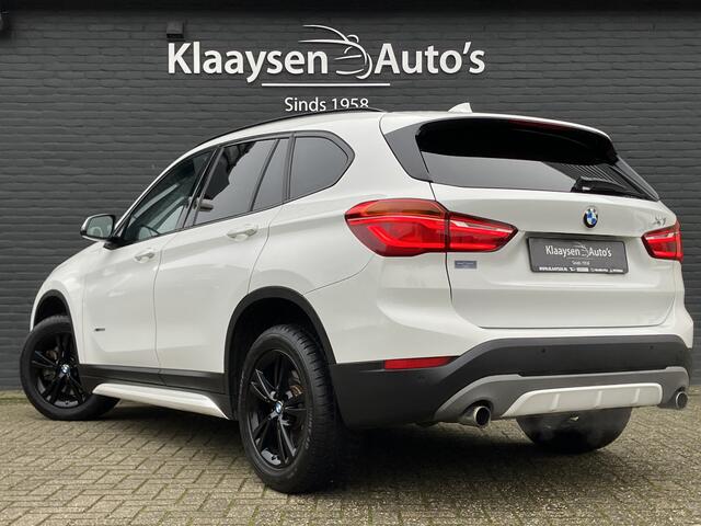 BMW X1 xDrive20i High Executive 192 pk AUT. | dealer onderhouden | navigatie | leder interieur | parkeersensoren | sportstoelen