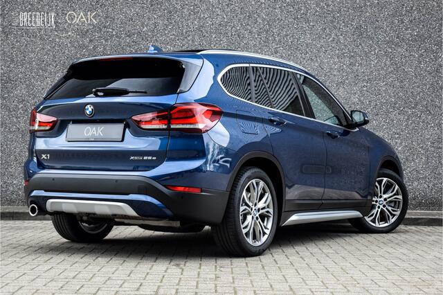 BMW X1 xDrive25e Aut. | X-Line | Navigatie | Panorama | Half Leder | Memory | Head-Up | Camera | 18"LM | Phytonic Blauw