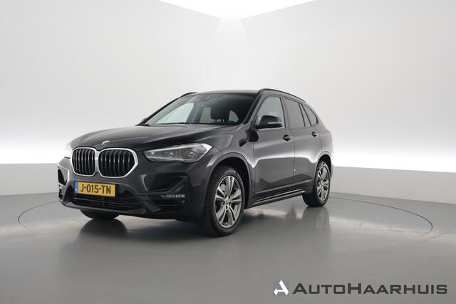 BMW X1 sDrive20i 192PK High Executive - Automaat | Afn. Trekhaak | Nav | Cruise | ACC | Led | Elek. Klep | Sfeerverl. | PDC | 1800kg trekg. V