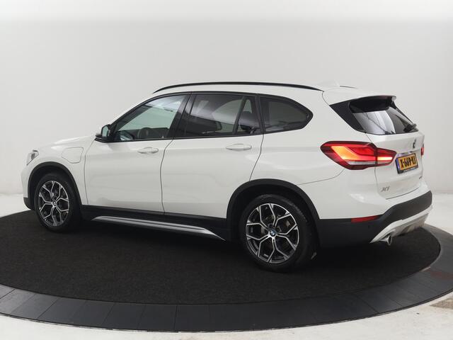 BMW X1 xDrive25e High Executive | SOH 85,2% | Half leder | Adaptive cruise | Stoelverwarming | Climate control | Navigatie | Camera | Park assist | Elektrische achterklep