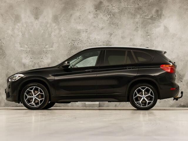 BMW X1 sDrive18i Sport High Executive 140Pk Automaat (PANORAMADAK, GROOT NAVI, MEMORY SEAT, LEDER, CAMERA, SPORTSTOELEN, TREKHAAK, STOELVERWARMING, NIEUWSTAAT)