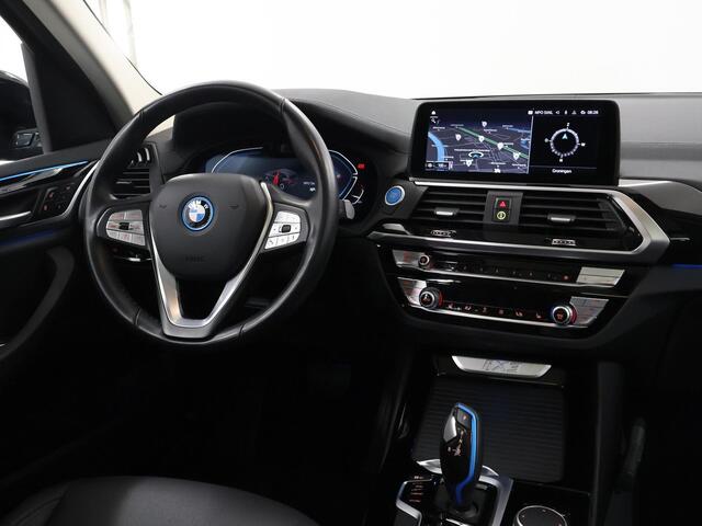 BMW X3 iX3 Executive 80 kWh | Elektrisch verstelbare stoelen + geheugen | Digitaal Dashboard | Camera | Apple CarPlay | Navigatie | Stoelverwarming | Standkachel | Panoramadak | Adaptieve Cruise Control | Trekhaak |