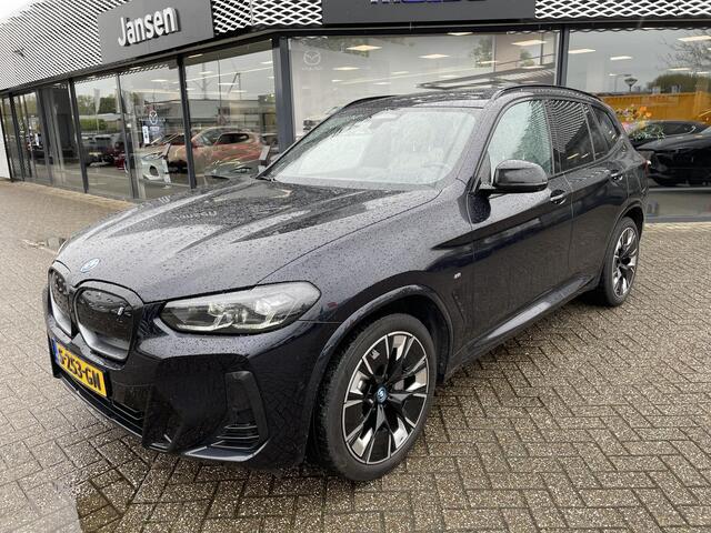 BMW X3 iX3 High Executive 80 kWh , Automaat, Trekhaak, Wit Leder, Harman/Kardon, Pano. dak, Adap. Cruise, Navi, Stoelverwarming, Stuurverwarming, LMV 20 Inch, Stoelgeheugen, HUD, Clima, Apple Carplay, 360 Camera, Stuurassistent, Elektrische achterklep, Parkeerhu
