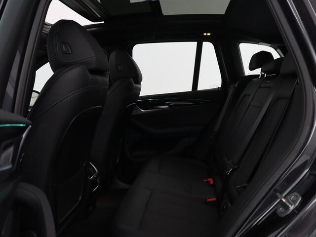 BMW X3 iX3 Executive 80 kWh | SOH 93,8% | Panoramadak | Leder | Stoelverwarming | Adaptive cruise | Carplay | Sfeerverlichting | Camera | Park assist | Elektrische achterklep | PHEV