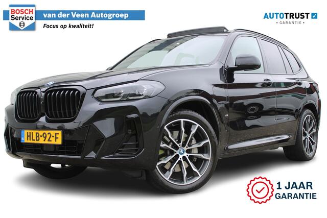 BMW X3 xDrive30e High Executive M-Sport | Incl. 12 maanden Garantie | SoH 96% | Panorama dak | Harman/Kardon Audiosysteem | Head-Up Display | Elektrisch verstelbare stoelen met memory | Adaptive cruise | 360° Camera | Elektrische kofferbakklep | Dodehoekdetectie | Stoelverwarming | Keyless entry/start | Navigatie | Parkeersensoren V+A | Apple CarPlay/Android Auto | Climate controle | Draadloze telefoonlader |