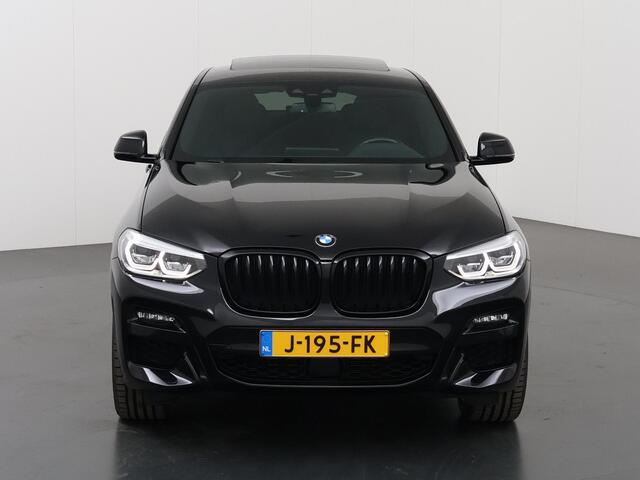 BMW X4 xDrive20i High Executive Edition | M-Sport | Navigatie | Parkeercamera | Stoel/stuurverwarming | Adaptieve Cruise Control | Harman/Kardon | HUD | Ele. verstelbare stoelen + Geheugen | Adaptief Onderstel | Panoramadak |
