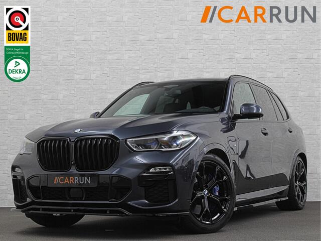 BMW X5 45e M-Stoelen | M-Performance | 360 Camera | ACC | Indiv. Leder | Harman-Kardon | Laser-LED | Keyless-Entry | Stoelventilatie | Head-Up | Memory | 21'' | Sfeerverlichting | Trekhaak | Luchtvering | Rij-Assistent Pro | Carplay | Black-Optic | Draadloos Lad