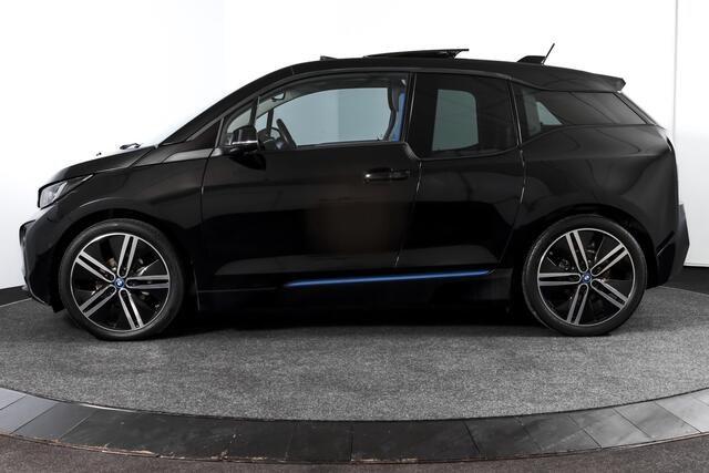 BMW i3 Basis 94Ah 33 kWh | S/k-panodak | Harman/Kardon | Dig. Cockpit | Adapt. cruise | Stoelverw. | PDC | Camera | NAV | ECC | LM 20" |