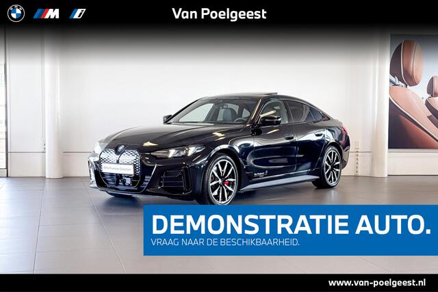 BMW i4 eDrive40 | M Sport | Stoelverwarming | Glazen Schuif-/kanteldak | Achteruitrijcamera |
