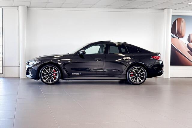 BMW i4 eDrive40 | M Sport | Stoelverwarming | Glazen Schuif-/kanteldak | Achteruitrijcamera |