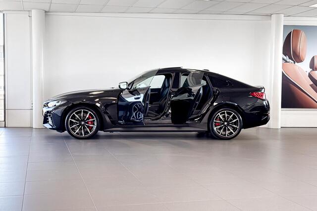 BMW i4 eDrive40 | M Sport | Stoelverwarming | Glazen Schuif-/kanteldak | Achteruitrijcamera |