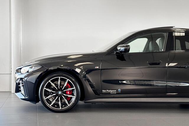 BMW i4 eDrive40 | M Sport | Stoelverwarming | Glazen Schuif-/kanteldak | Achteruitrijcamera |