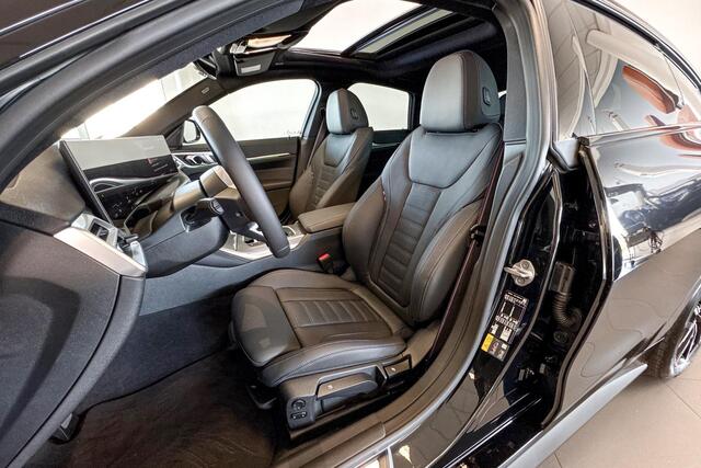 BMW i4 eDrive40 | M Sport | Stoelverwarming | Glazen Schuif-/kanteldak | Achteruitrijcamera |