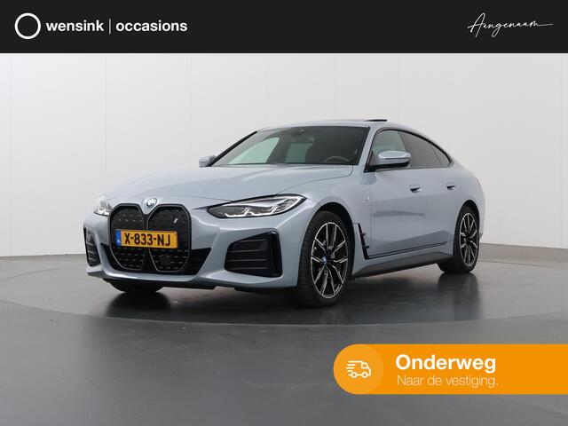 BMW i4 eDrive40 84 kWh M-Sport | Schuif/Kanteldak | Trekhaak Ele.wegklapbaar | Sportstoelen | LED | Ele.kofferdeksel | Adaptieve Cruise Control | Navigatie | Camera |