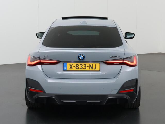 BMW i4 eDrive40 84 kWh M-Sport | Schuif/Kanteldak | Trekhaak Ele.wegklapbaar | Sportstoelen | LED | Ele.kofferdeksel | Adaptieve Cruise Control | Navigatie | Camera |