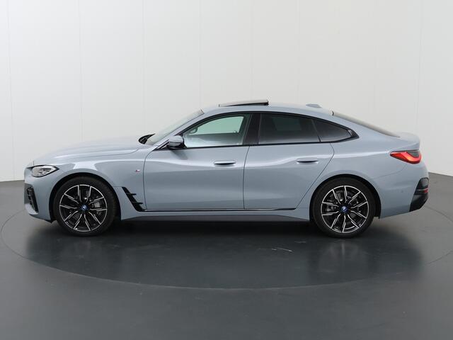 BMW i4 eDrive40 84 kWh M-Sport | Schuif/Kanteldak | Trekhaak Ele.wegklapbaar | Sportstoelen | LED | Ele.kofferdeksel | Adaptieve Cruise Control | Navigatie | Camera |