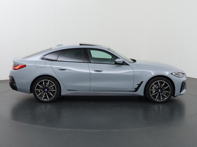 BMW i4 eDrive40 84 kWh M-Sport | Schuif/Kanteldak | Trekhaak Ele.wegklapbaar | Sportstoelen | LED | Ele.kofferdeksel | Adaptieve Cruise Control | Navigatie | Camera |