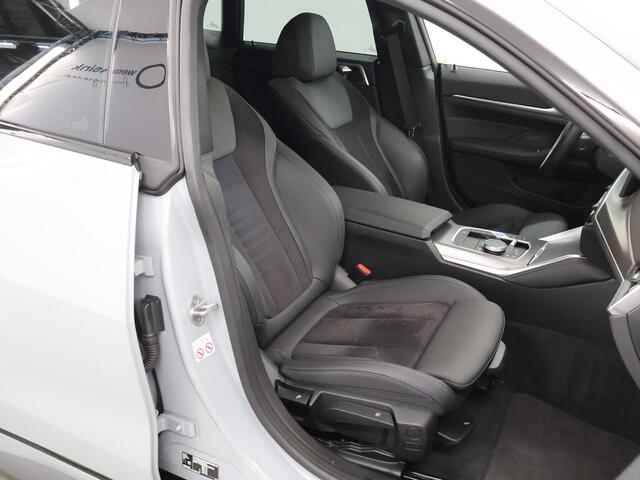 BMW i4 eDrive40 84 kWh M-Sport | Schuif/Kanteldak | Trekhaak Ele.wegklapbaar | Sportstoelen | LED | Ele.kofferdeksel | Adaptieve Cruise Control | Navigatie | Camera |