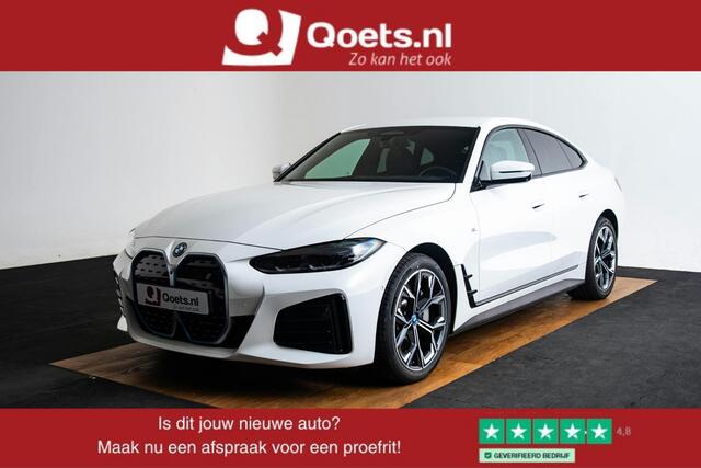BMW i4 eDrive40 High Executive 84 kWh M Sport - Trekhaak - Parking/Driving Assistant - Comfort Access - Harman Kardon - Elektrisch verwarmde stoelen - Stuurwielrand verwarmd - Getinte Ruiten - Adaptief M Onderstel -