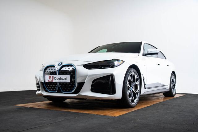 BMW i4 eDrive40 High Executive 84 kWh M Sport - Trekhaak - Parking/Driving Assistant - Comfort Access - Harman Kardon - Elektrisch verwarmde stoelen - Stuurwielrand verwarmd - Getinte Ruiten - Adaptief M Onderstel -