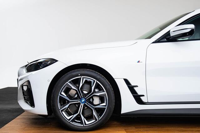 BMW i4 eDrive40 High Executive 84 kWh M Sport - Trekhaak - Parking/Driving Assistant - Comfort Access - Harman Kardon - Elektrisch verwarmde stoelen - Stuurwielrand verwarmd - Getinte Ruiten - Adaptief M Onderstel -