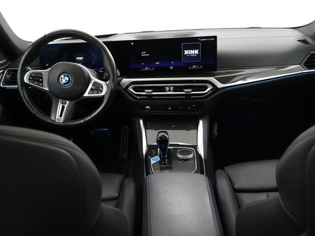 BMW i4 M50 High Executive 84 kWh | SOH 98% | M-Sport | Schuif/Kantel dak | Sportstoelen | Harman/Kardon | x-Drive | Widescreen | Adaptief Onderstel | DAB | Stoelen/stuur verwarmbaar | Trekhaak | Laserlicht |