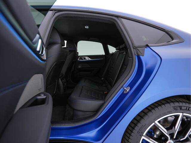 BMW i4 M50 M-Sportpack High Executive 84 kWh [ 3-Fase ] {SOH-97%} (INCL-BTW) *HEAD-UP | LASER-LED | LUXURY-LEATHER | HARMAN/KARDON | ADAPTIVE-CRUISE | BLIND-SPOT | TOP-VIEW | HEATED-SPORTSEATS | DAB+ | WIDE-COCKPIT | AMBIENT-LIGHT | NAVI-FULLMAP | 19