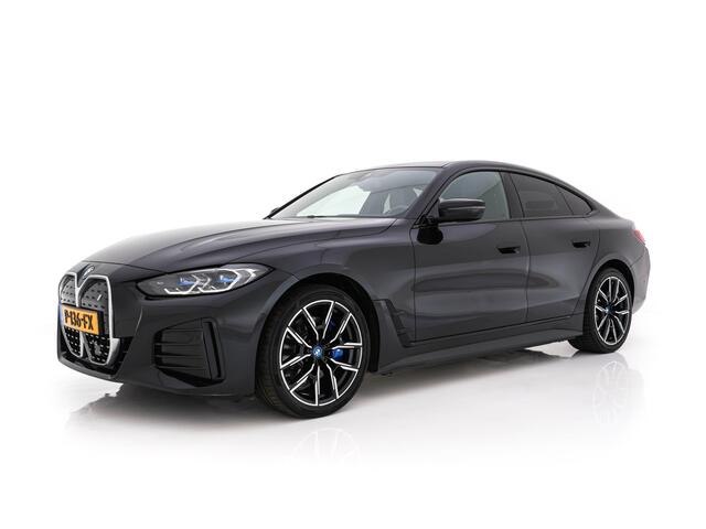 BMW i4 eDrive40 High Executive 84 kWh M-Sportpack [ 3-Fase ] {SOH-93%} (INCL.BTW) Aut *LEATHER | HEAD UP | FULL-LED | HIFI-SOUND | CRUISE | WIDESCREEN-COCKPIT | DAB+ | CAMERA | AMBIENTLIGHT | CARPLAY | HEATED-SPORTSEATS | PRIVACY-GLASS | 19''ALU*