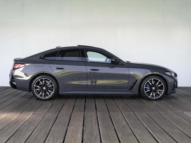 BMW i4 Gran Coupé M50 | M Sportpakket | High Executive | Stuurwielrand verwarmd | Adaptief M Onderstel | Glazen schuif-/kanteldak | Driving Assistant Professional | Trekhaak