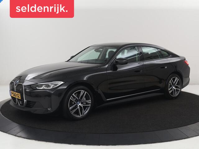 BMW i4 eDrive40 84 kWh | SOH 93,8% | Camera | Adaptive cruise | Climate control | Navigatie | DAB+ | Bluetooth | Stoelverwarming | Carplay