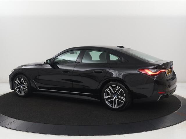 BMW i4 eDrive40 84 kWh | SOH 93,8% | Camera | Adaptive cruise | Climate control | Navigatie | DAB+ | Bluetooth | Stoelverwarming | Carplay