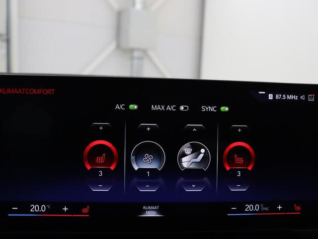 BMW i4 eDrive40 84 kWh | SOH 93,8% | Camera | Adaptive cruise | Climate control | Navigatie | DAB+ | Bluetooth | Stoelverwarming | Carplay