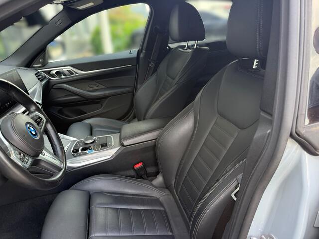 BMW i4 eDrive40 High Executive 84 kWh M Sport | Panoramadak | Stoelverwarming | Stuurverwarming | Harman Kardon | Adaptive Cruise Control | Laser LED | 360 Camera | Keyless | Navigatie | Head-Up Display | Ambiance Verlichting |