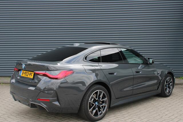 BMW i4 eDrive40 84 kWh M-Sport Dravitgrau Schuif-/kanteldak Leer Harman-Kardon Camera