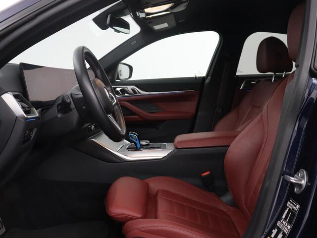 BMW i4 M50 High Executive 84 kWh | SOH 94,4% | Leder | Adaptive cruise | xDrive | Stoelverwarming | Head-up | Harman/Kardon | Carplay | Sfeerverlichting | 360 camera | Park assist | Elektrische achterklep