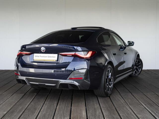 BMW i4 eDrive40 | High Executive | M Sport | Schuif-/kanteldak | Driving Assistant Professional | Stuurwielrand verwarmd | Head Up Display