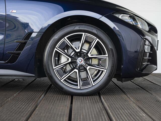 BMW i4 eDrive40 | High Executive | M Sport | Schuif-/kanteldak | Driving Assistant Professional | Stuurwielrand verwarmd | Head Up Display
