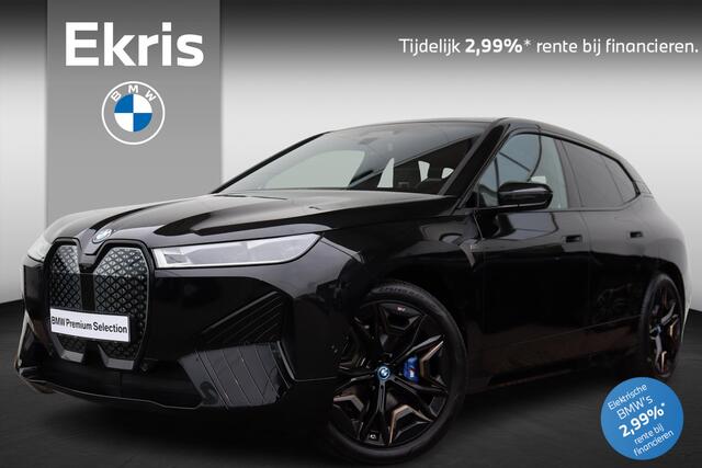 BMW iX M60 High Executive 112 kWh Comfort Acces / Soft Close / Integrale Active Besturing / Panoramadak / Stoelventilatie / Multifunctionele Stoelen / Harman Kardon / Warmte Comfort Pakket / Driving Assistent Professional / Laserlicht / Parking Assistant Profes
