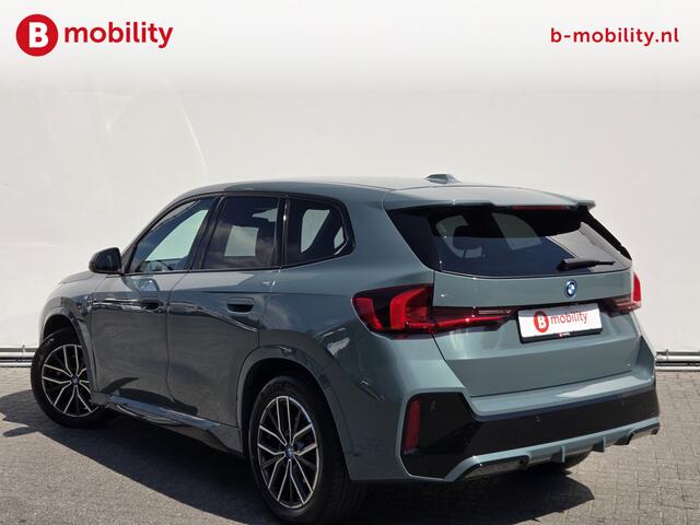 BMW iX1 eDrive20 67 kWh M-Sport SOH 99% Driving Assist. Plus | Sportstoelen | Park Assist | Leer | Adaptive Cruise Control | DAB | NL Auto! | Achteruitrijcamera